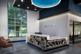 Architectural photography of the reception area in a modern office building.