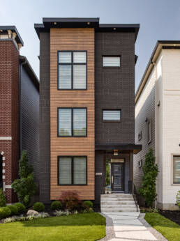 A modern home with a black and brown exterior captured by a professional architectural photographer in Charlotte, North Carolina