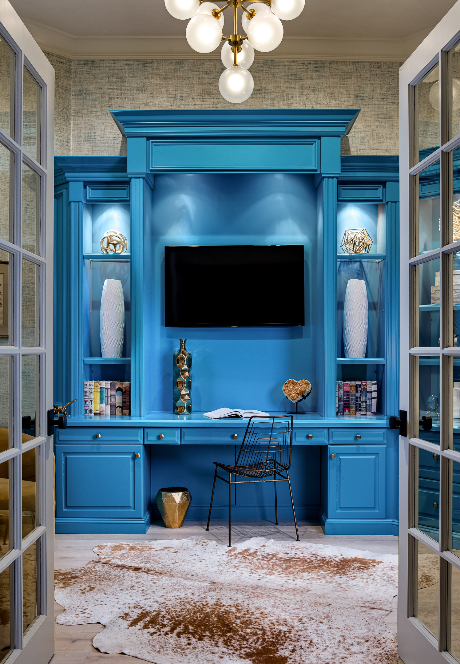 An office with a blue built-in desk