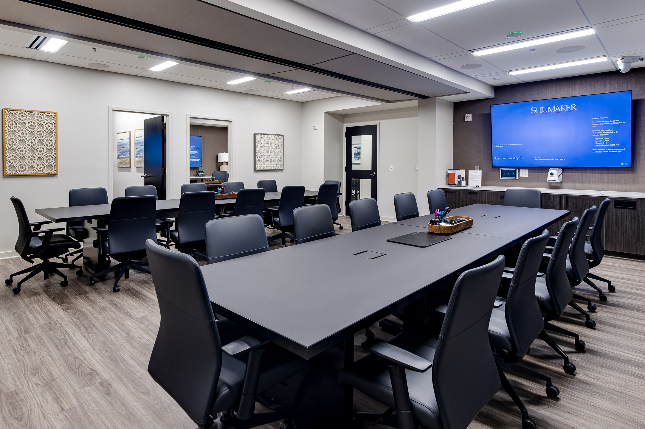 A conference room, complete with a spacious table and chairs. captured by professional architectural photographer