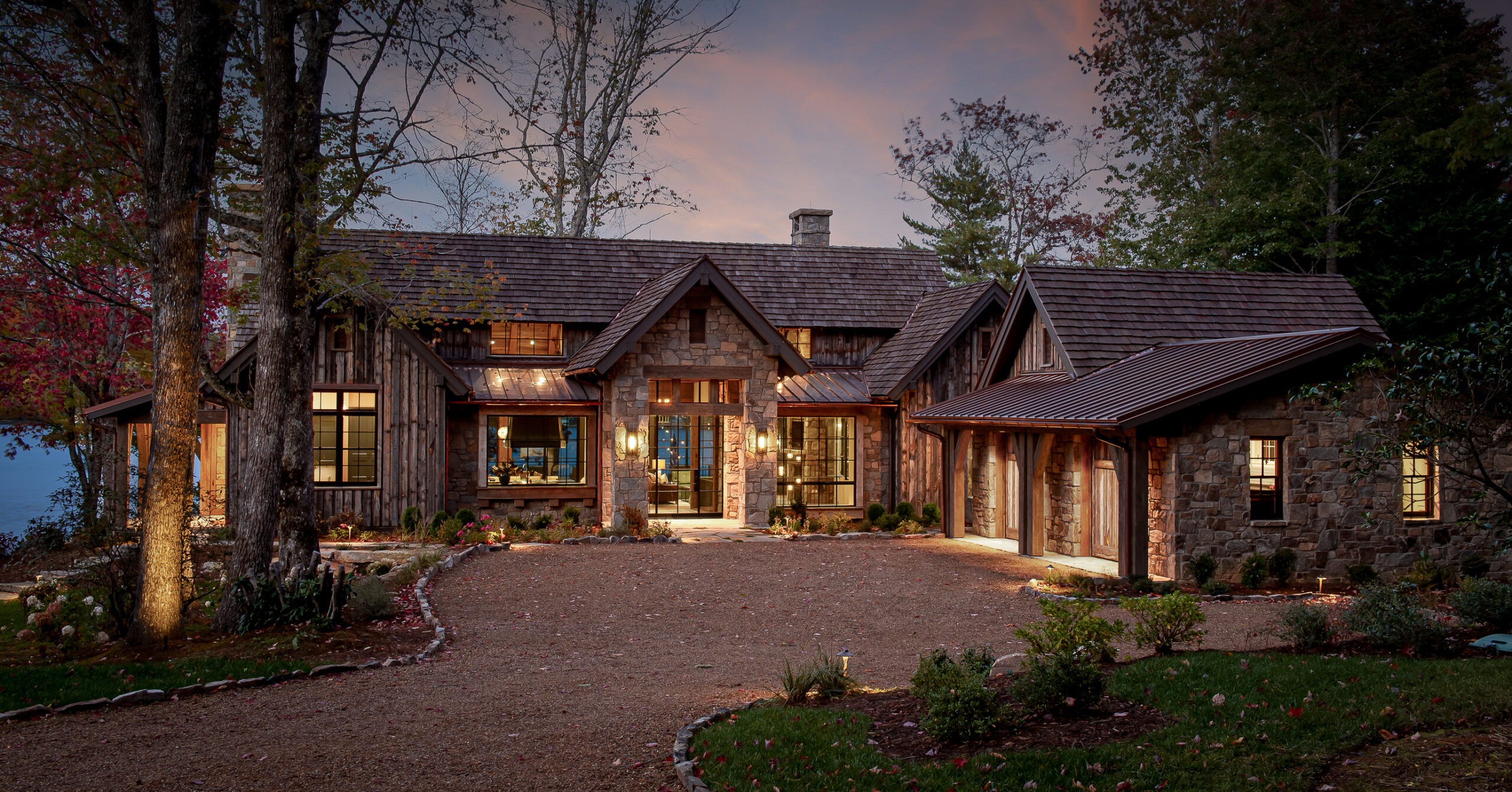 A home with a stone driveway and wood siding. captured by professional architectural photographer in South Carolina