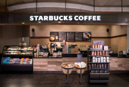 a starbucks coffee shop in a shopping mall.