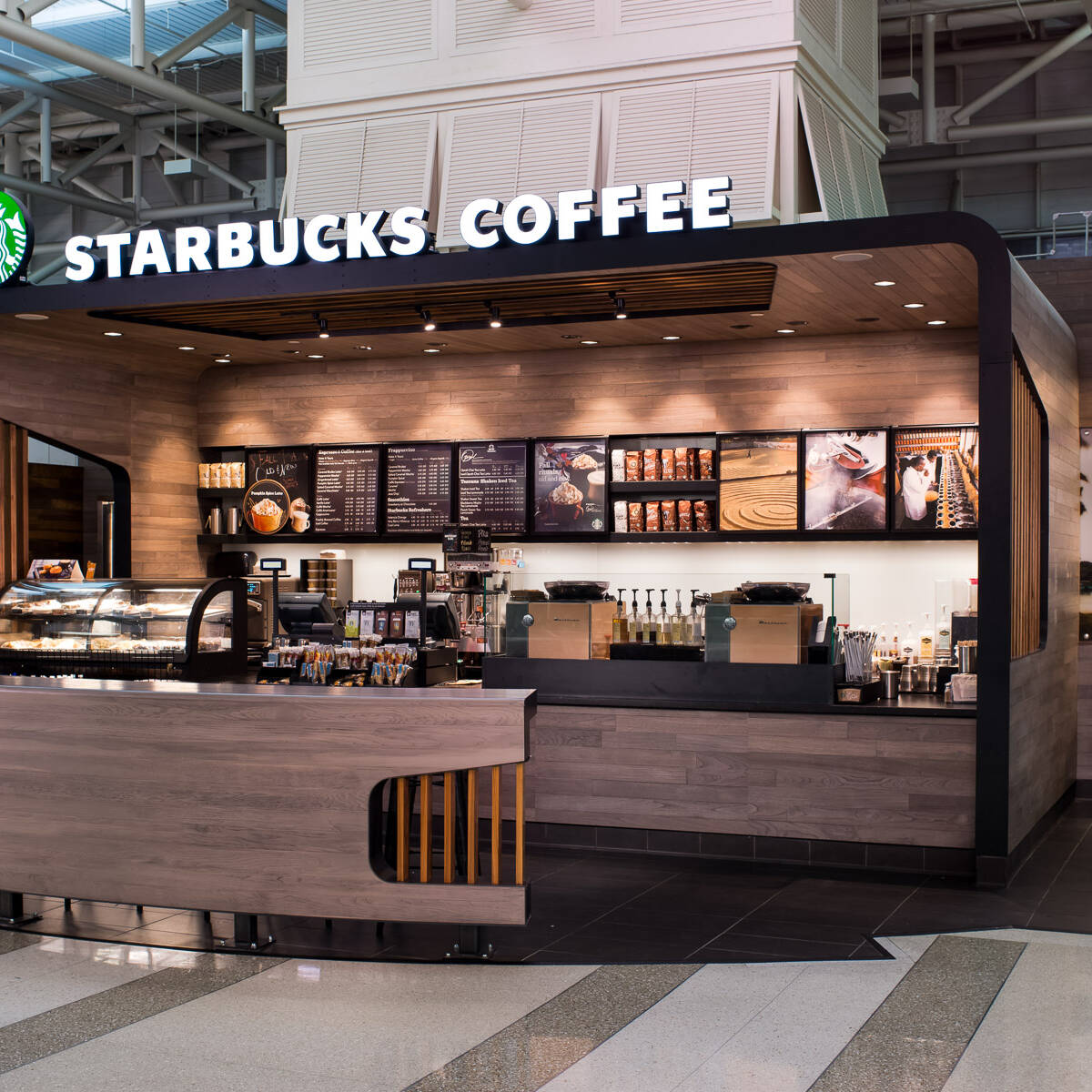a starbucks coffee shop in an airport photographed by interiors photographer in Charlotte, North Carolina