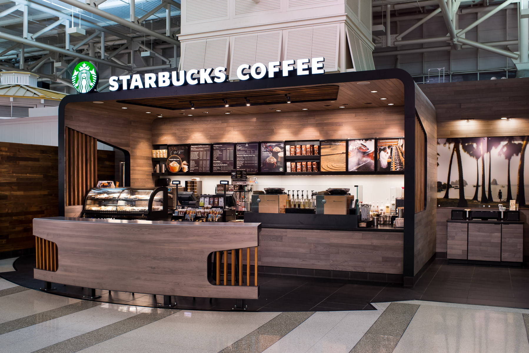 a starbucks coffee shop in an airport photographed by interiors photographer in Charlotte, North Carolina