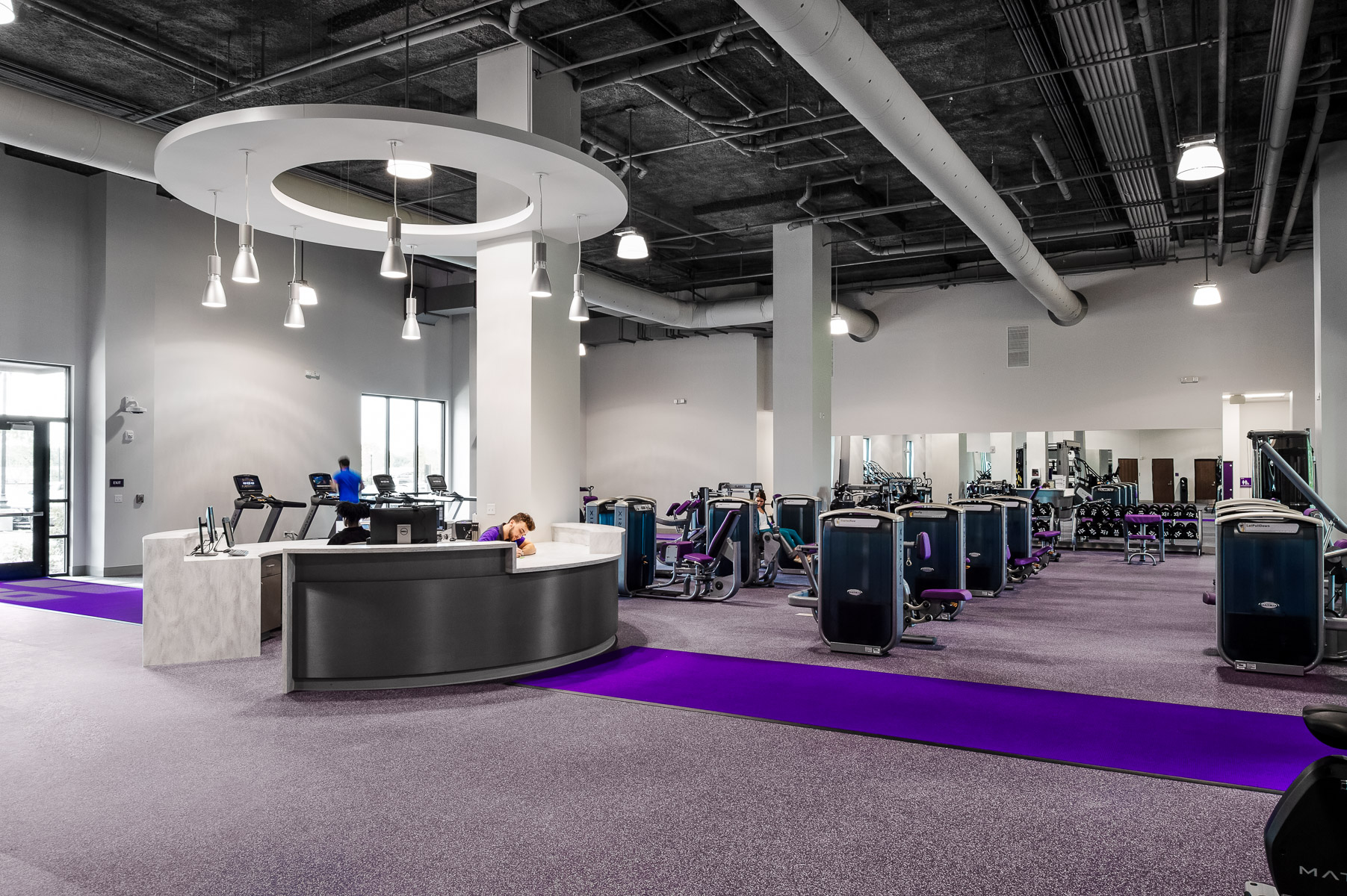 a gym with purple carpet and equipment captured by Andy Frame an architectural photographer in Raleigh, North Carolina