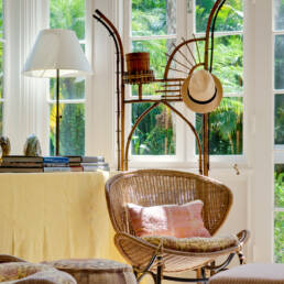 a wicker chair in a room.