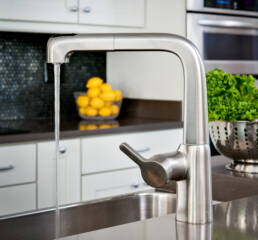a kitchen sink with a faucet.