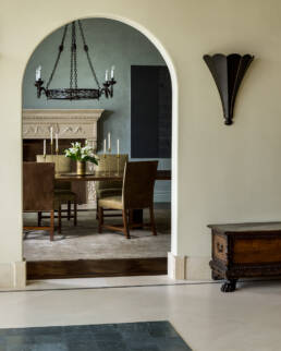 an archway leads into a dining room.