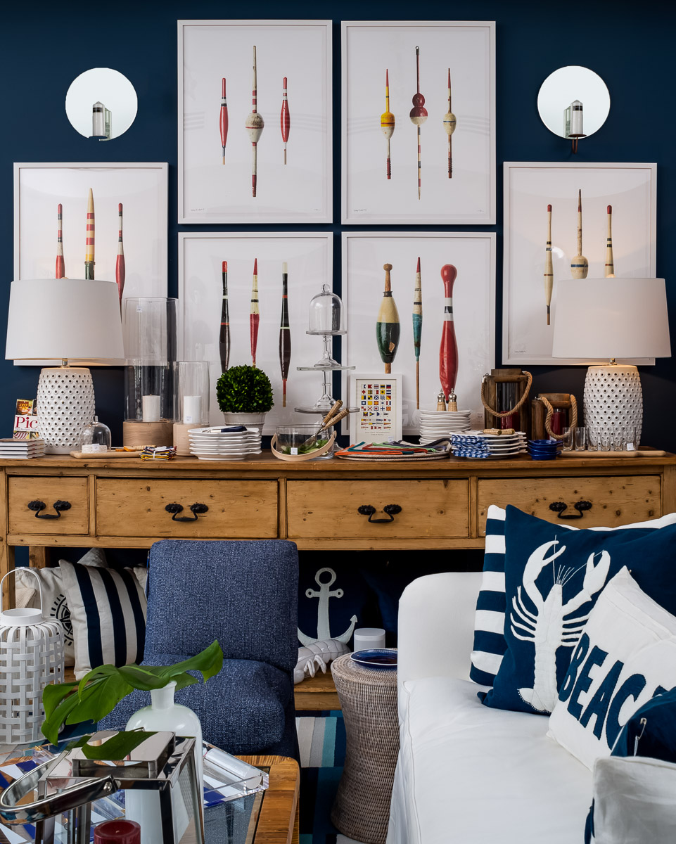 a living room with blue walls and nautical decor.