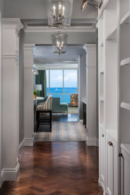 a hallway with a view of the ocean.
