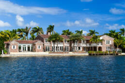 a brick house on a body of water.