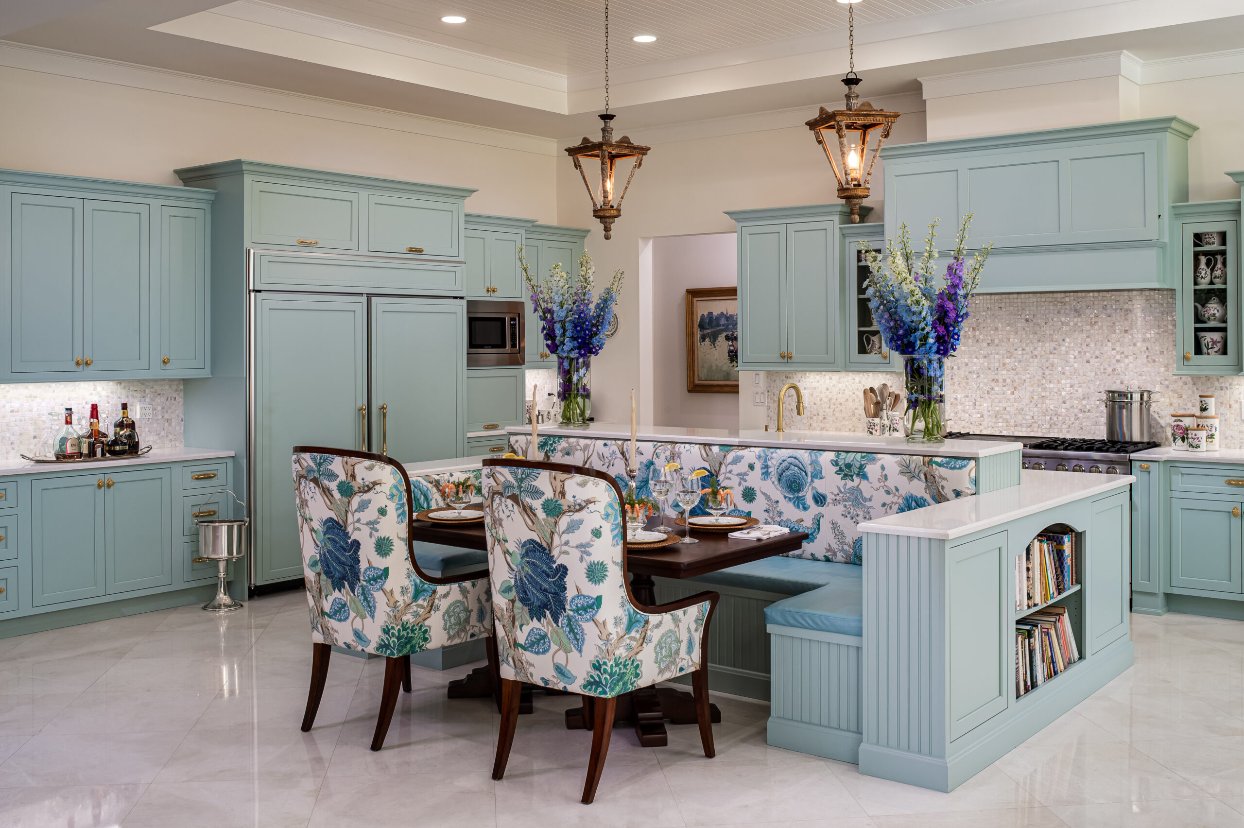 a kitchen with blue cabinets and a table and chairs.